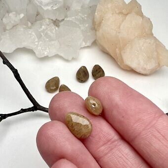 Alternative view of 10x7mm Faceted Teardrop Pear Man Made Rutilated Quartz Paired Beads