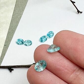 Alternative view of 7x5mm Oval Cut Pointed Back Blue Topaz Paired Beads