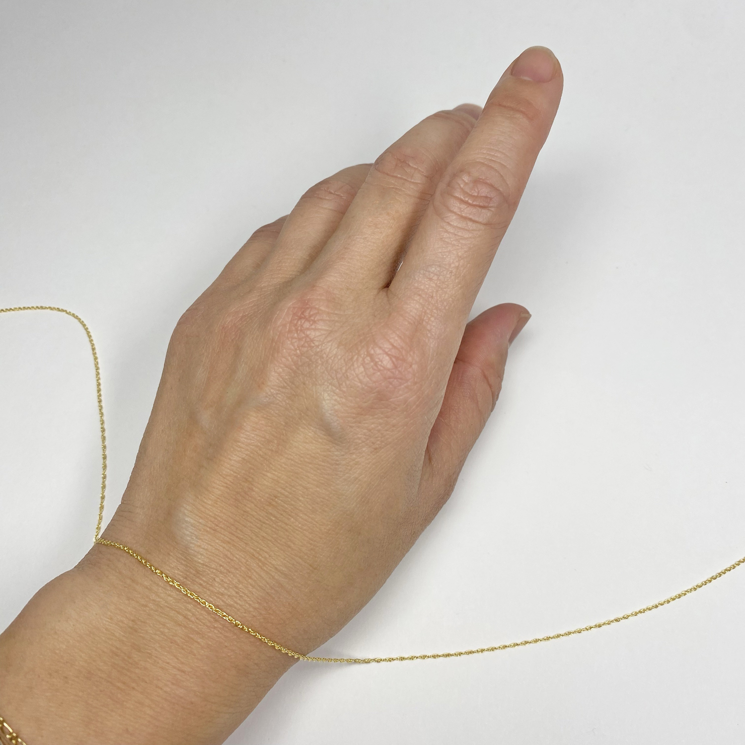 cx66t solid 10kt gold 1 05mm fine rope chain by the inch hand