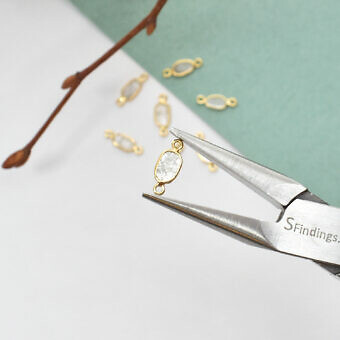 Medium Oval Natural Grey Diamond Slices Bezel in Solid 14kt Gold Connector Hold By A Pair of Precision Pliers
