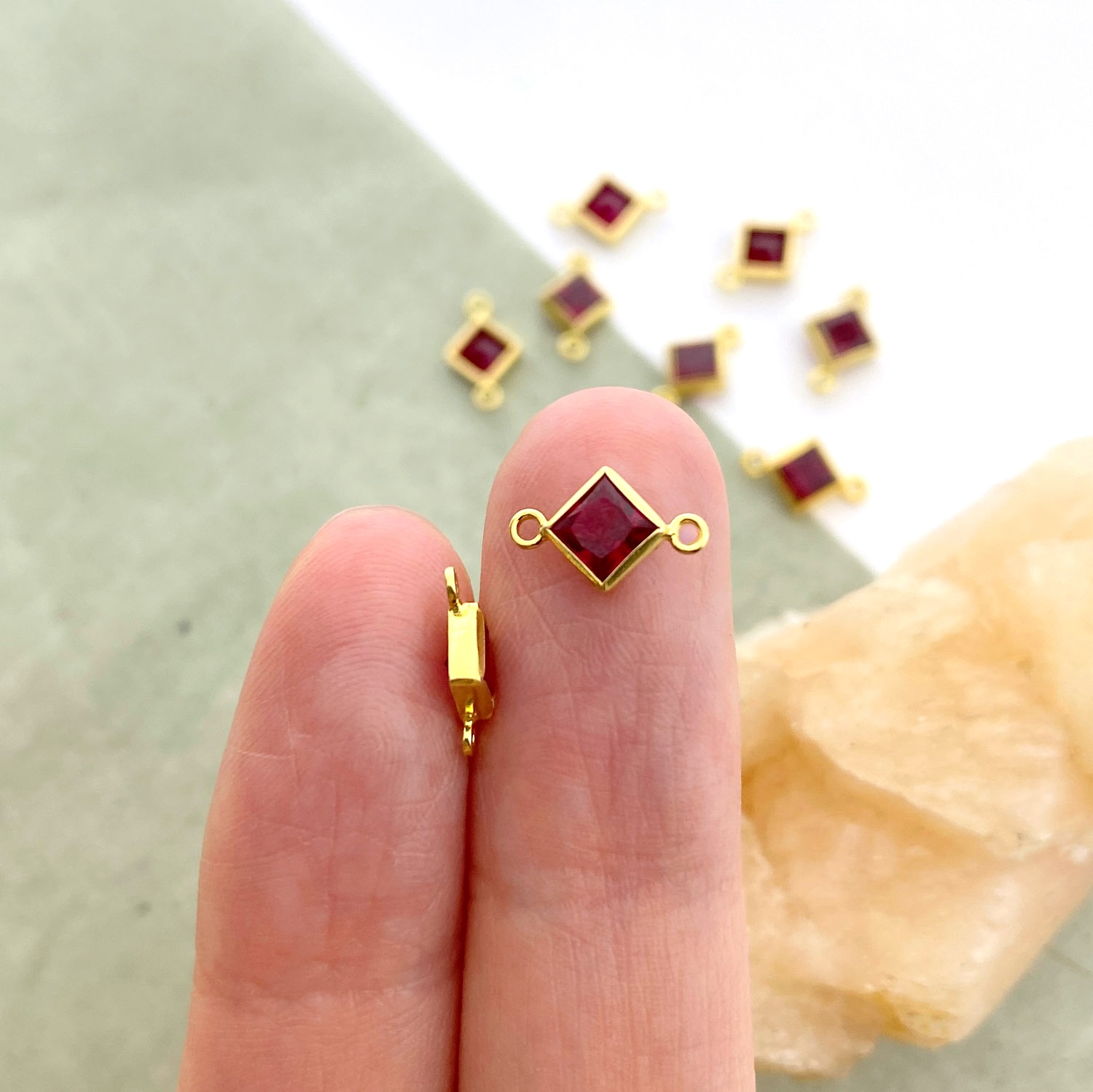 foa22g-4mm-bright-red-diamond-bezel-set-cz-crystal-14kt-gold-filled-birthstones-connector-pendant-charm-july-hand